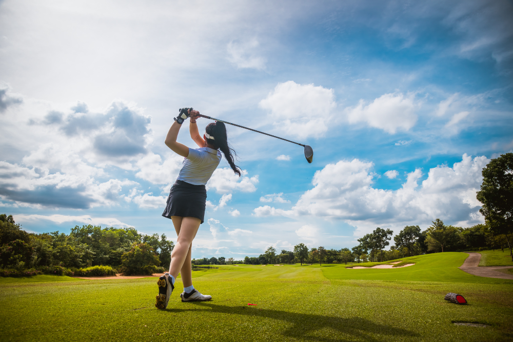 female golfer taking swing